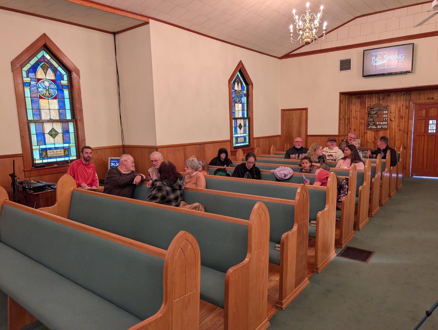 Church members spending time together in the sanctuary